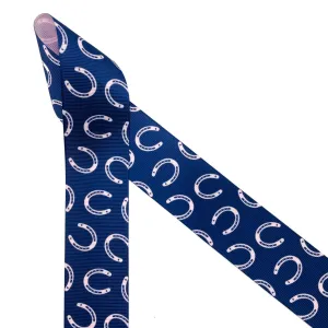 Equestrian ribbon horse shoes tossed on a navy blue  background printed on  1.5" pink grosgrain,